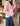 Pull à capuche rayé rose et blanc
