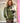 Blouson femme Johanna Paris en simili cuir vert olive, coupe oversize, bandes écrues sur les manches et fermetures façon brandebourgs.