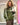 Blouson femme Johanna Paris en simili cuir vert olive, coupe oversize, bandes écrues sur les manches et fermetures façon brandebourgs.