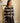 Gilet rayé chocolat et écru Johanna Paris, 38 % laine, finitions dentelle et boutons recouverts.