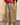 Pantalon jupe-culotte Johanna Paris à carreaux beige et bordeaux, coupe ample avec ceinture camel à boucle dorée.