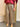 Pantalon jupe-culotte Johanna Paris à carreaux beige et bordeaux, coupe ample avec ceinture camel à boucle dorée.