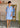 Robe forme trapèze unie manche ballon brodé coloris bleu ciel