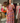 Robe longue fleurie grande taille doublée avec décolleté en V et taille froncée, imprimé floral orange violet et fuchsia.