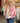 Veste brodée réversible rose Johanna Paris avec broderies florales multicolores portée en boutique MC by Chloé Ronchin.